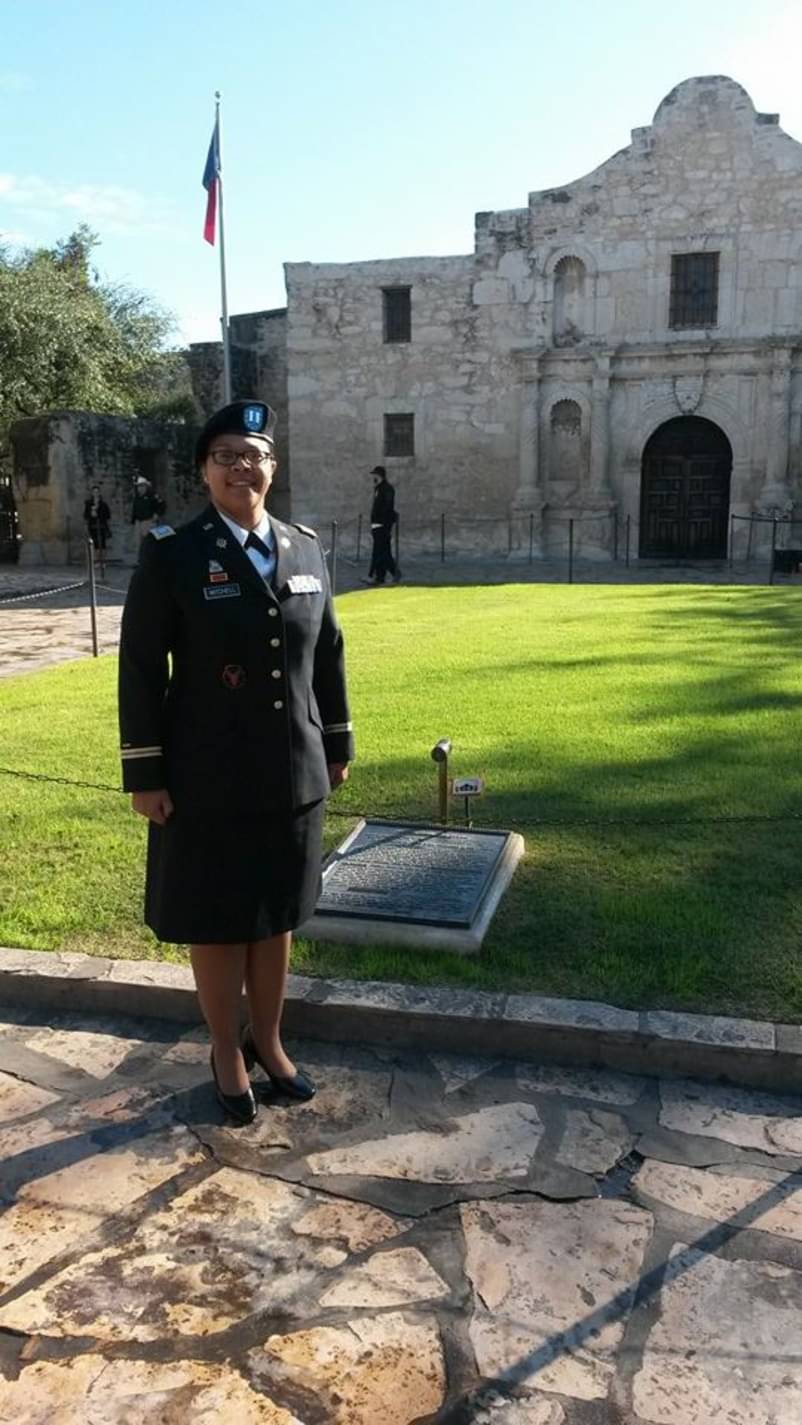 Tiffany Mitchell in dress uniform standing at the Alamo