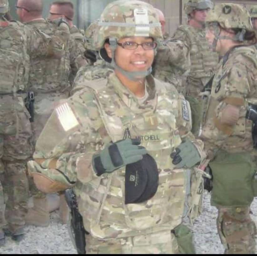Tiffany Mitchell in combat uniform giving a thumbs-up to the camera