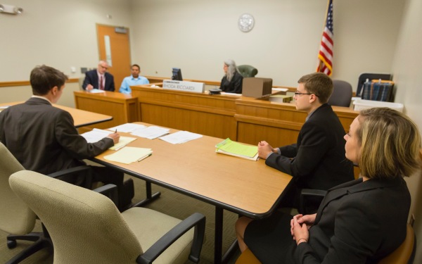 Neighborhood clinic students and professor in court