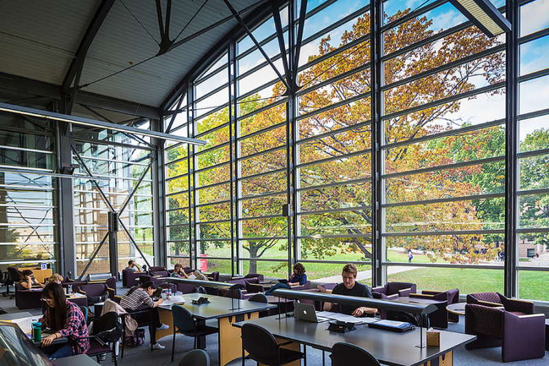 main reading room in the library with large windows