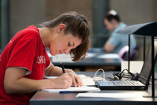 student studying in the library