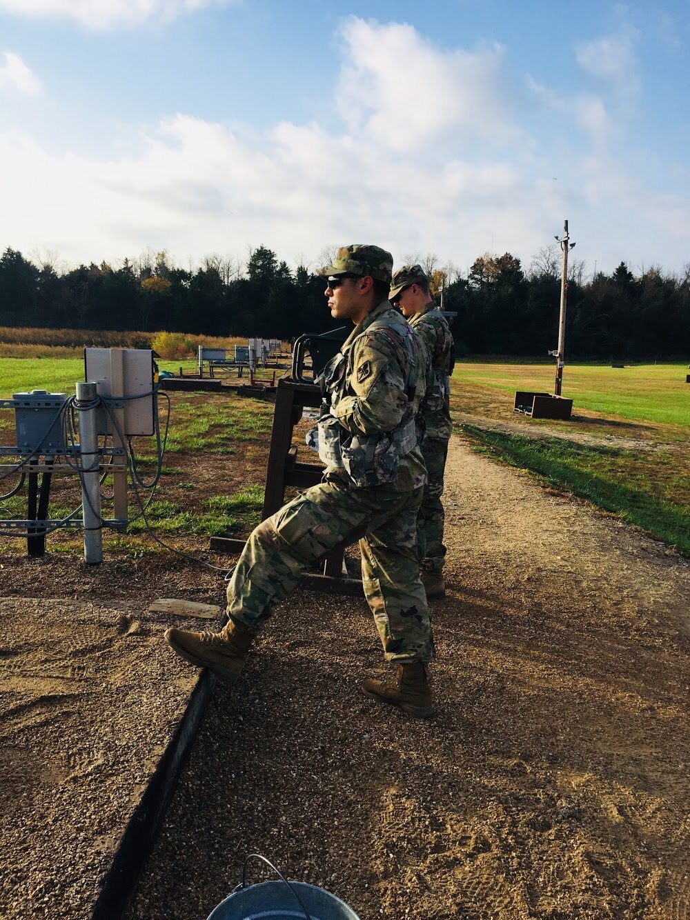 A photo of Brandon Loredo in military fatigues on what appears to be a military training session.