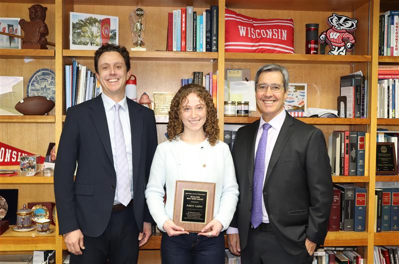 Professor Dustin Brown (left) and Dean Dan Tokaji (right) award Ariel A. Leykin with the 2025 Best Brief Award.