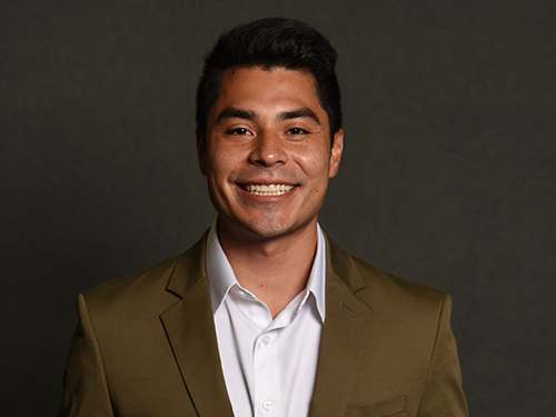 Headshot photo of Brandon Loredo smiling at the camera.