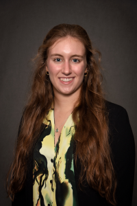 student dressed in yellow shirt and black blazer