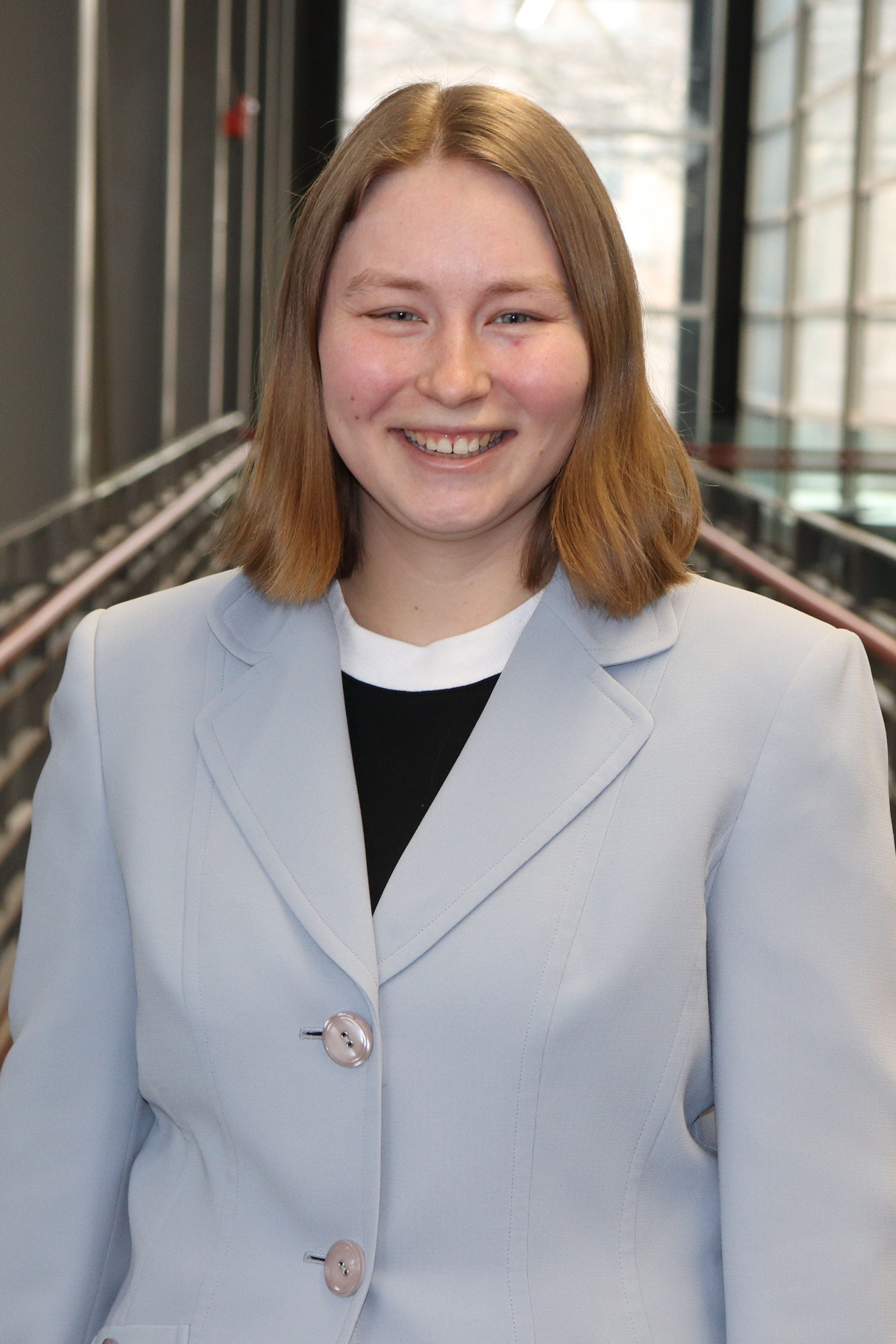 Headshot of Leah Herbeck in light blue blazer.