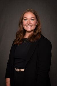 Woman in black blazer with black shirt