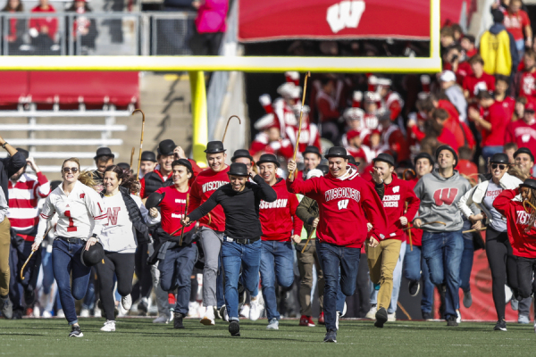 Students running in the Cane Toss