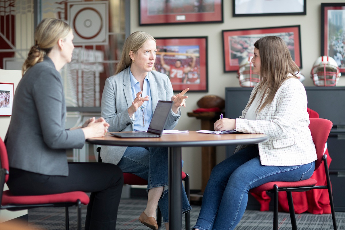 photo of staff and students at a table