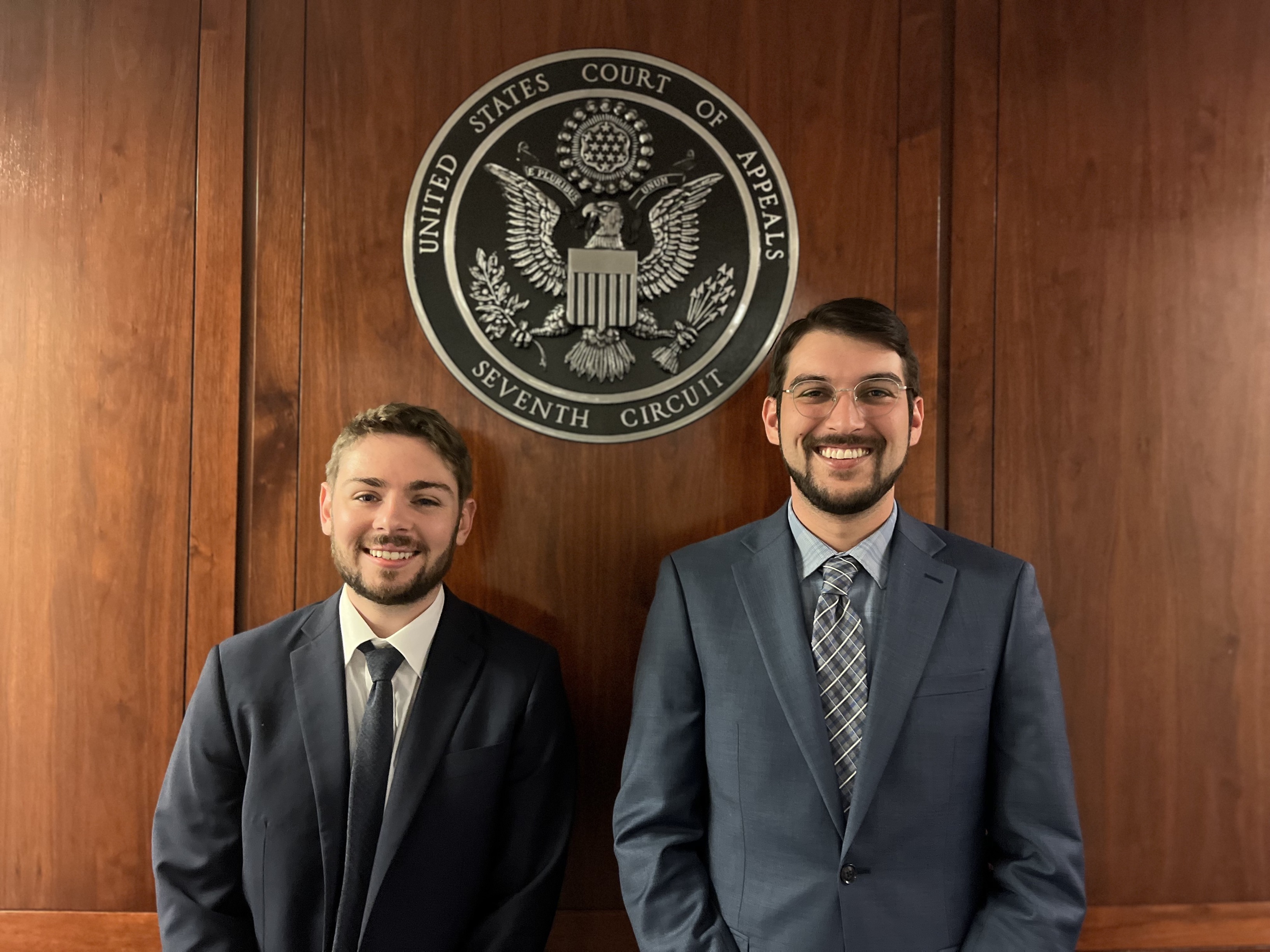 students and mentors in a courtroom